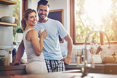 Buy stock photo Smile, portrait and couple drinking coffee in home kitchen for support, care or morning. Tea, happy man or woman together for connection, love or laugh at funny joke for bonding with partner in house