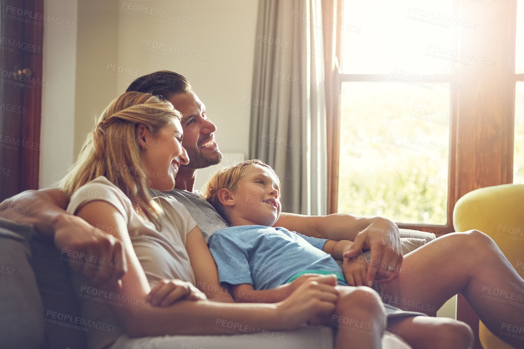 Buy stock photo Shot of a family of three spending some quality time at home