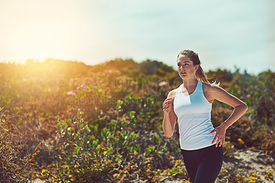 Buy stock photo Woman running in nature, fitness outdoor with cardio and training for marathon with young athlete and sports. Female runner in bush, sunshine and run for exercise with healthy person and mockup space