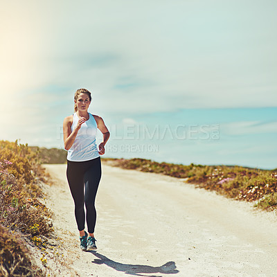 Buy stock photo Woman running on road, fitness outdoor with cardio and training for race with athlete, sports and mockup space. Female runner in nature, blue sky and run for exercise with healthy and active person