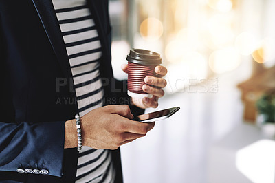 Buy stock photo Cropped shot of a businessman using a mobile phone in a modern office