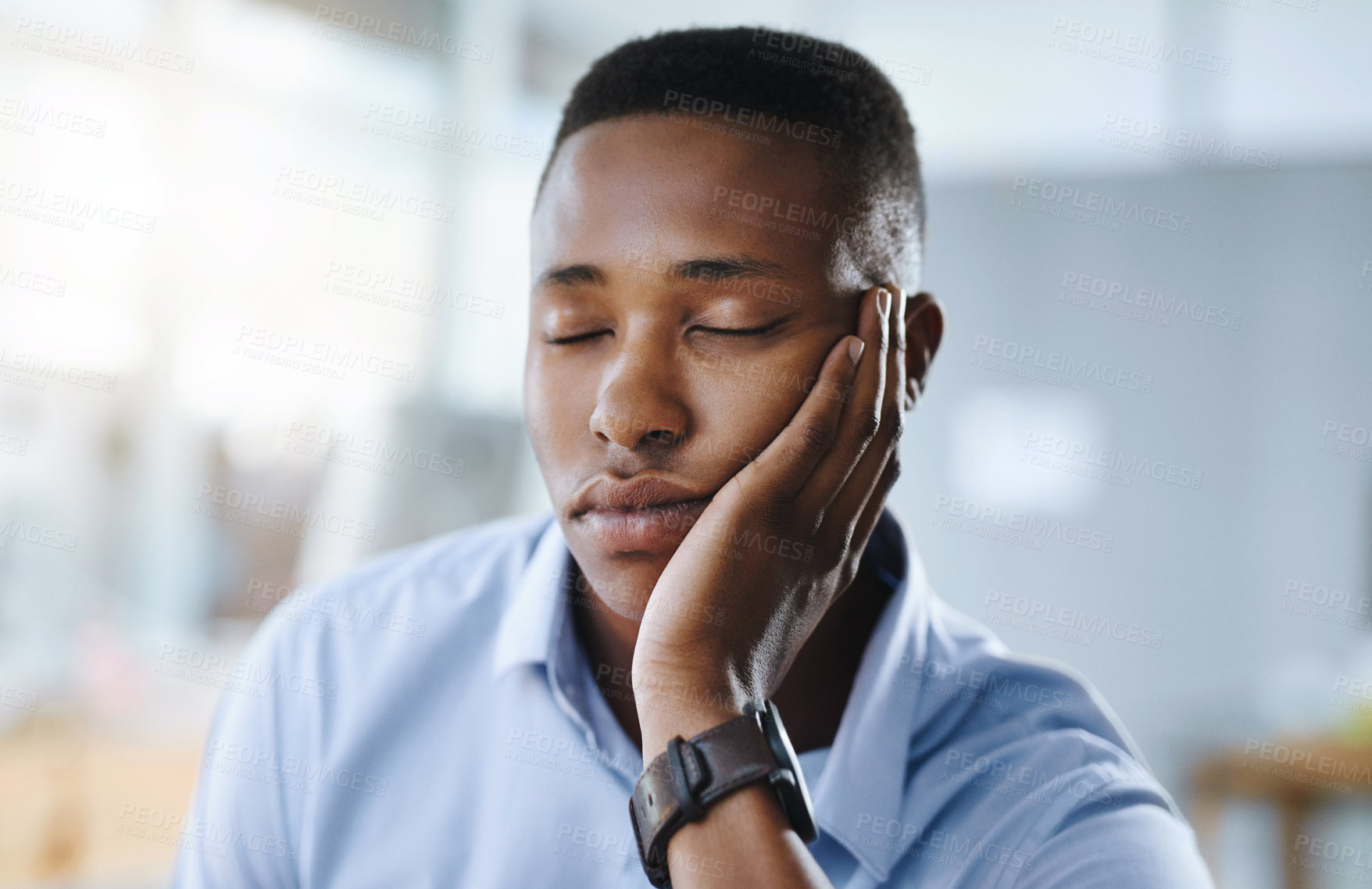 Buy stock photo Sleeping, business or tired black man in office overwhelmed by deadlines with fatigue or burnout. Lazy worker, depressed consultant or exhausted professional resting or taking nap on hand with stress