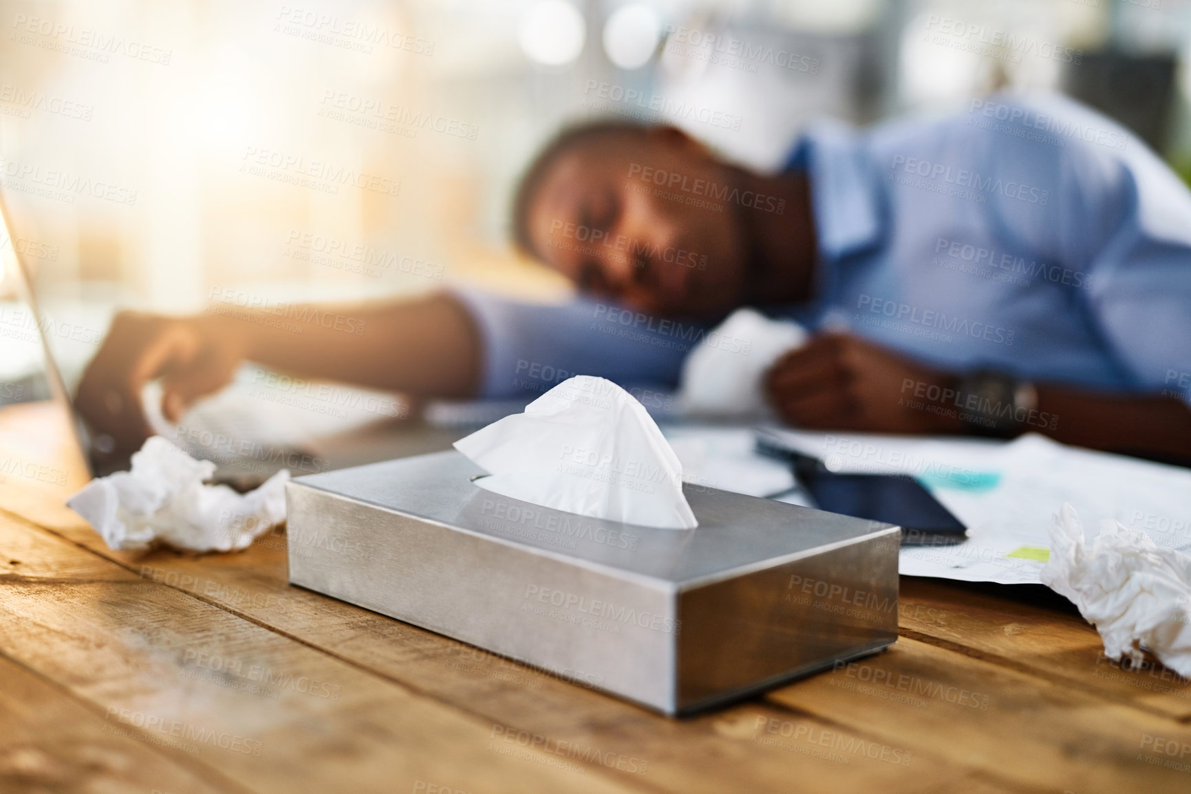 Buy stock photo Sick, sleep and man on desk with flu virus, allergy and sinusitis or fatigue by laptop with tissues. Overworked, tired and person with illness for rest, burnout and recovery in office with symptoms