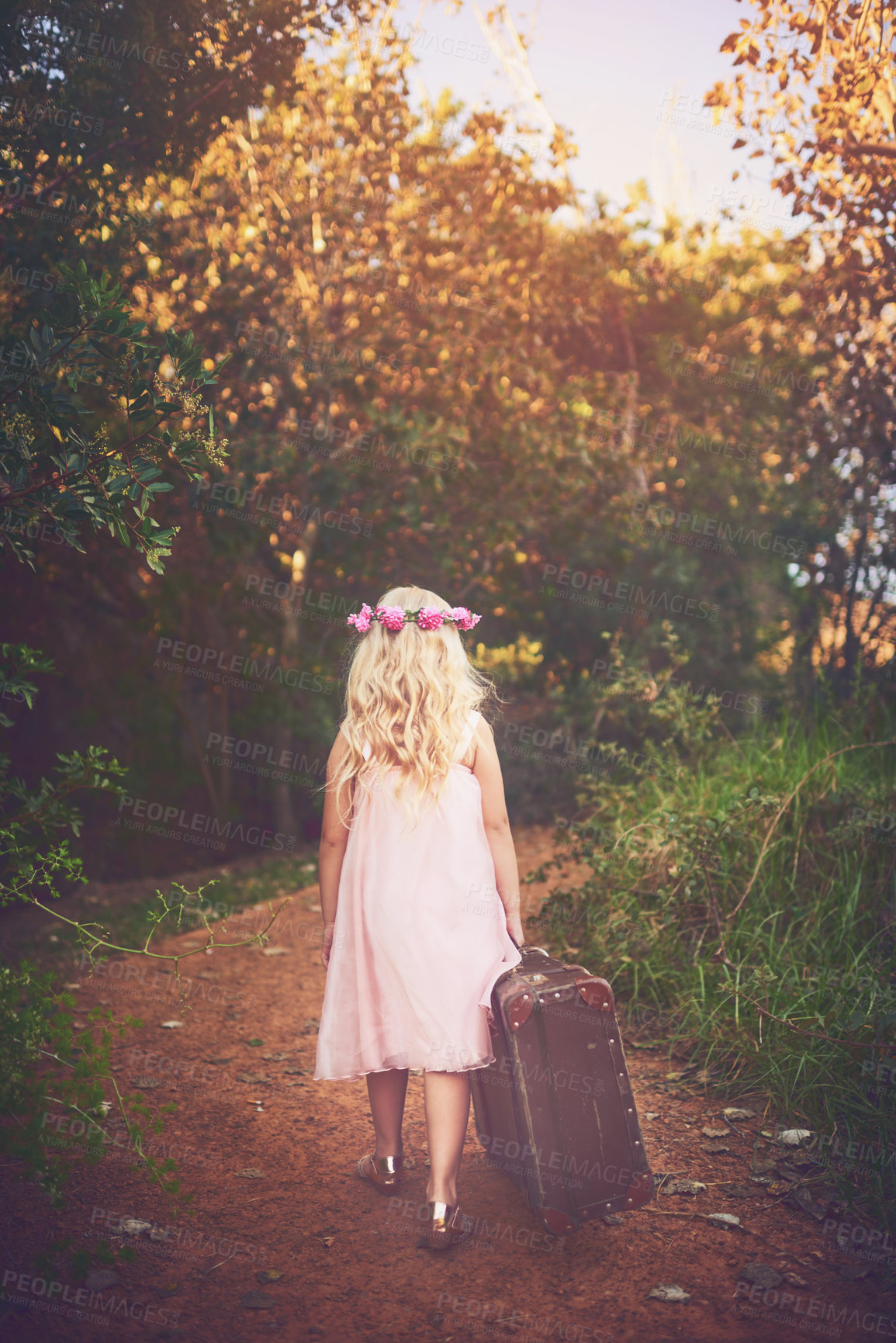 Buy stock photo Back, suitcase and walking with girl in forest for adventure, fantasy or journey as runaway. Children, magic and travel with lost kid outdoor on path in nature or park for discovery and exploration