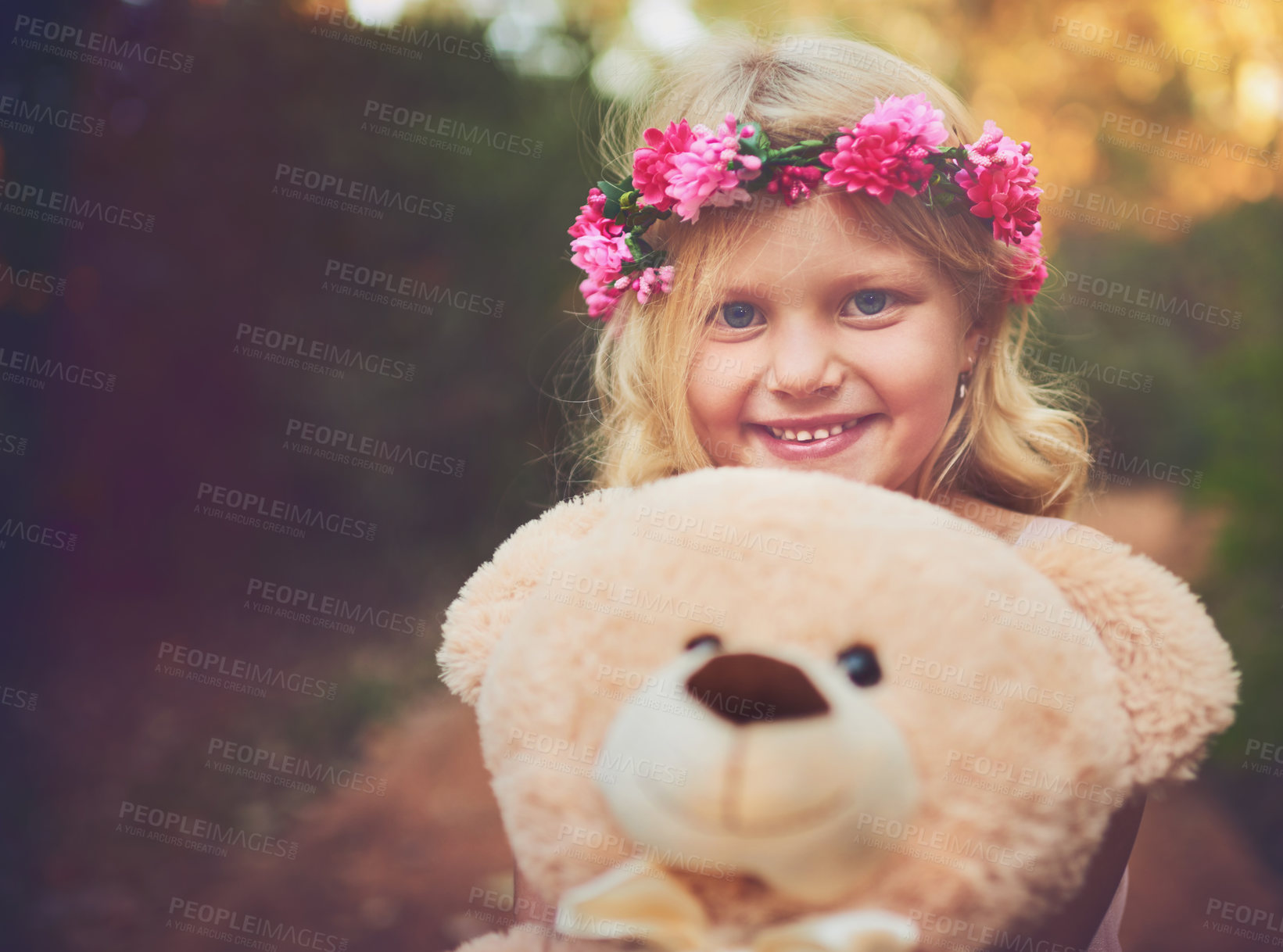 Buy stock photo Excited, flower crown and portrait of child with teddy bear in nature for fantasy, imagination or play time in forest. Happy, sweet and cute girl kid from Germany with plush toy outdoor in woods.