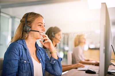 Buy stock photo Cropped shot of a group of young women working in a call center