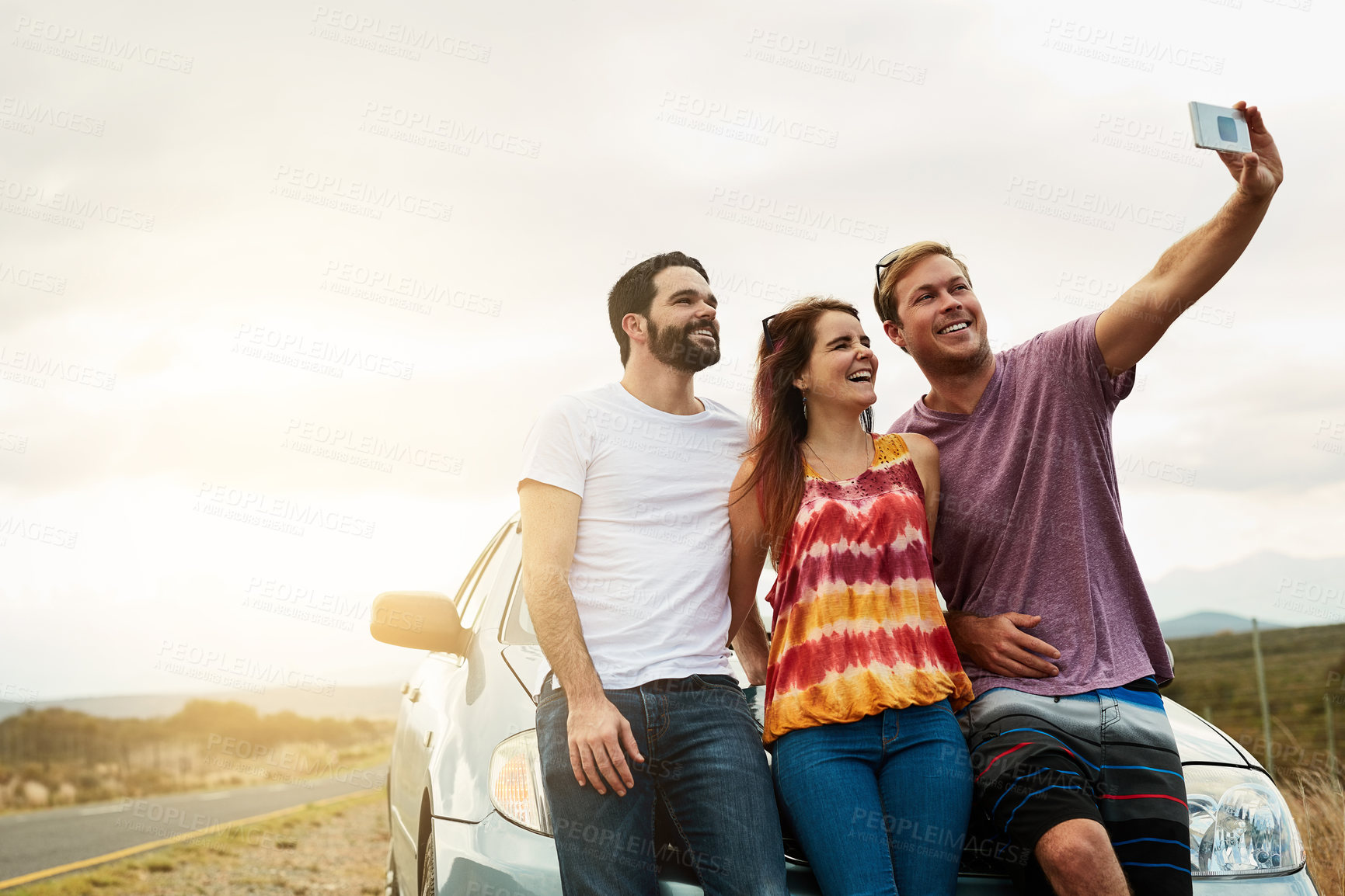 Buy stock photo Road trip, selfie and smile with friends outdoor together for holiday, travel or vacation in nature. Hug, memory or social media with happy men and woman at car on roadside to capture profile picture