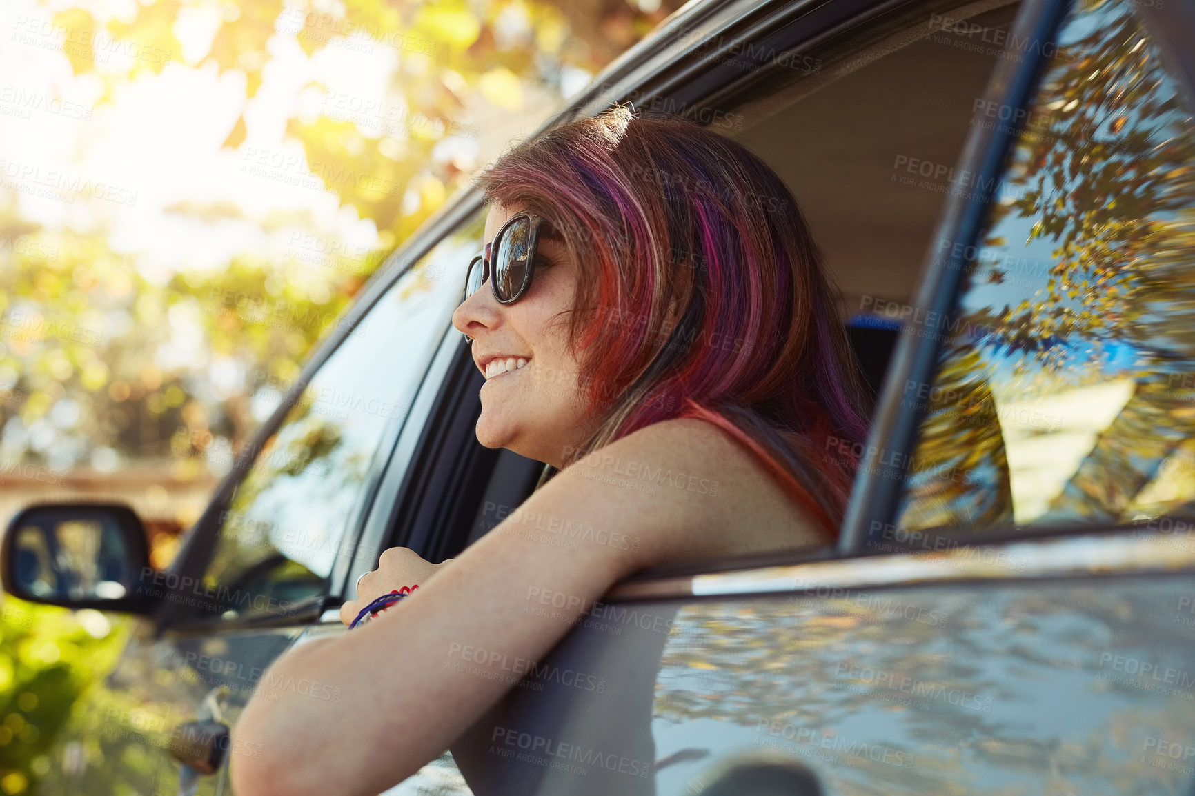 Buy stock photo Shot of young woman taking a break and enjoying nature while sitting in the backseat of a car