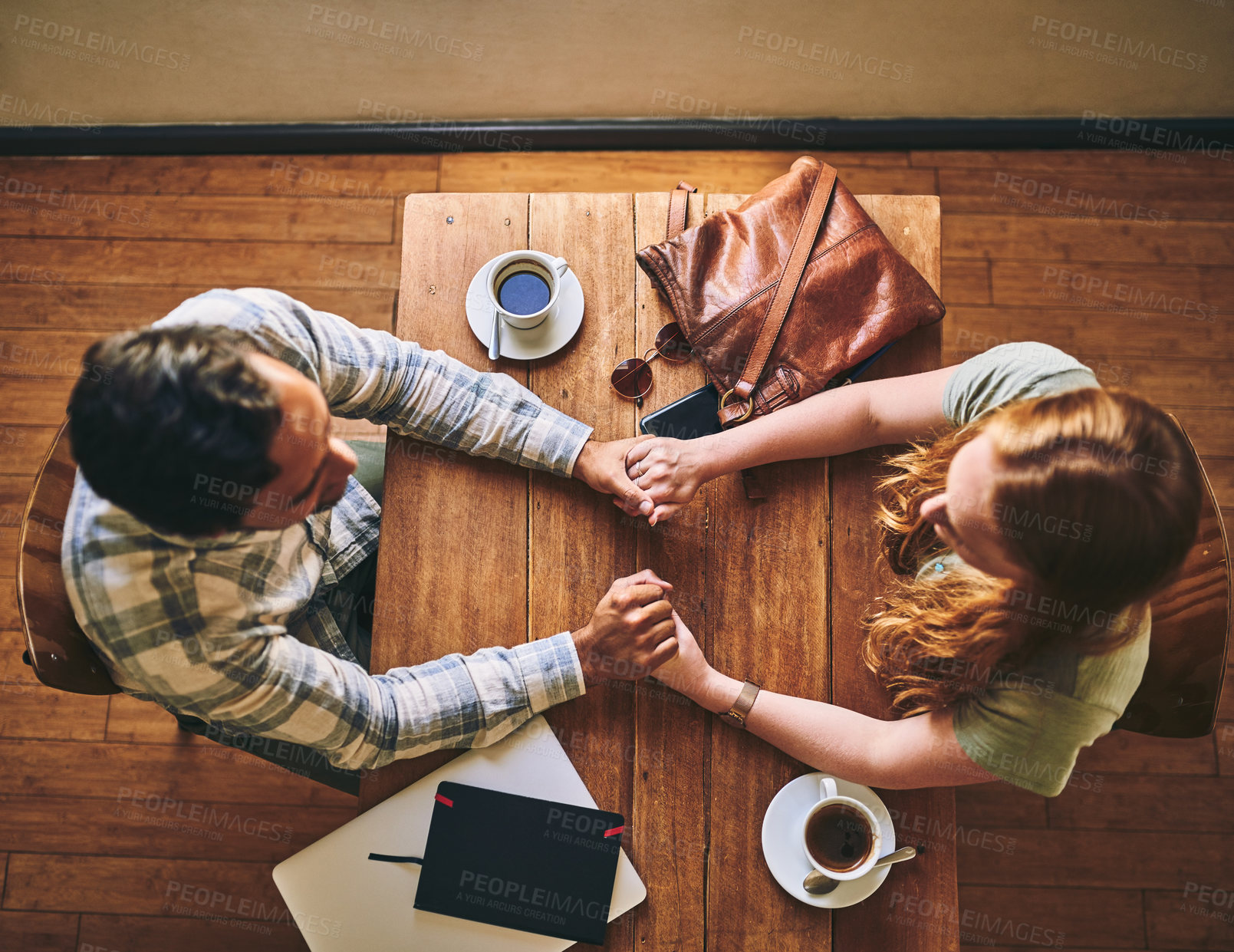 Buy stock photo Top view, couple and holding hands in cafe, celebration and relax together, Valentines day and romance. Romantic, man and woman with love, coffee shop and talking for relationship, loving and bonding