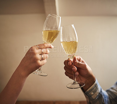 Buy stock photo Shot of an unrecognizable couple toasting at a cafe