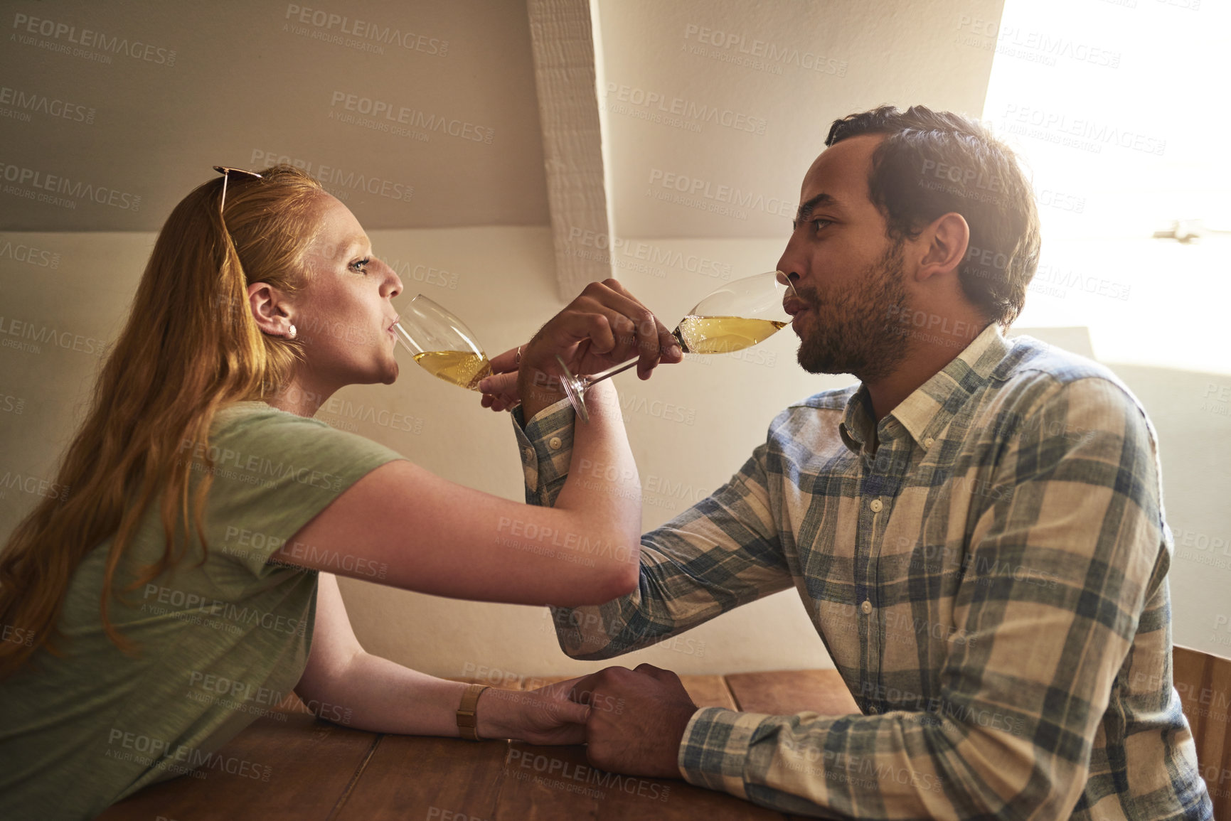 Buy stock photo Love, champagne and toast with couple in restaurant for celebration, happy and valentines day. Date, fine dining and wine with man and woman at table for romance, relationship and anniversary 