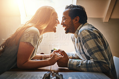 Buy stock photo Love, couple and holding hands on table at restaurant, laughing at funny joke and bonding. Valentines day, romance diversity and affection, passion or care of man and woman enjoying date time at cafe