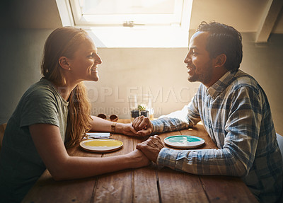 Buy stock photo Love, couple and holding hands at cafe on table, talking and bonding together. Valentines day, romance diversity and affection of man and woman on date, having fun or enjoying time in restaurant.
