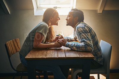 Buy stock photo Shot of a young couple spending time together at a cafe