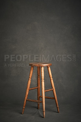 Buy stock photo Studio shot of a wooden stool against a gray background