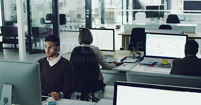 Buy stock photo High angle shot of corporate businesspeople working in their office
