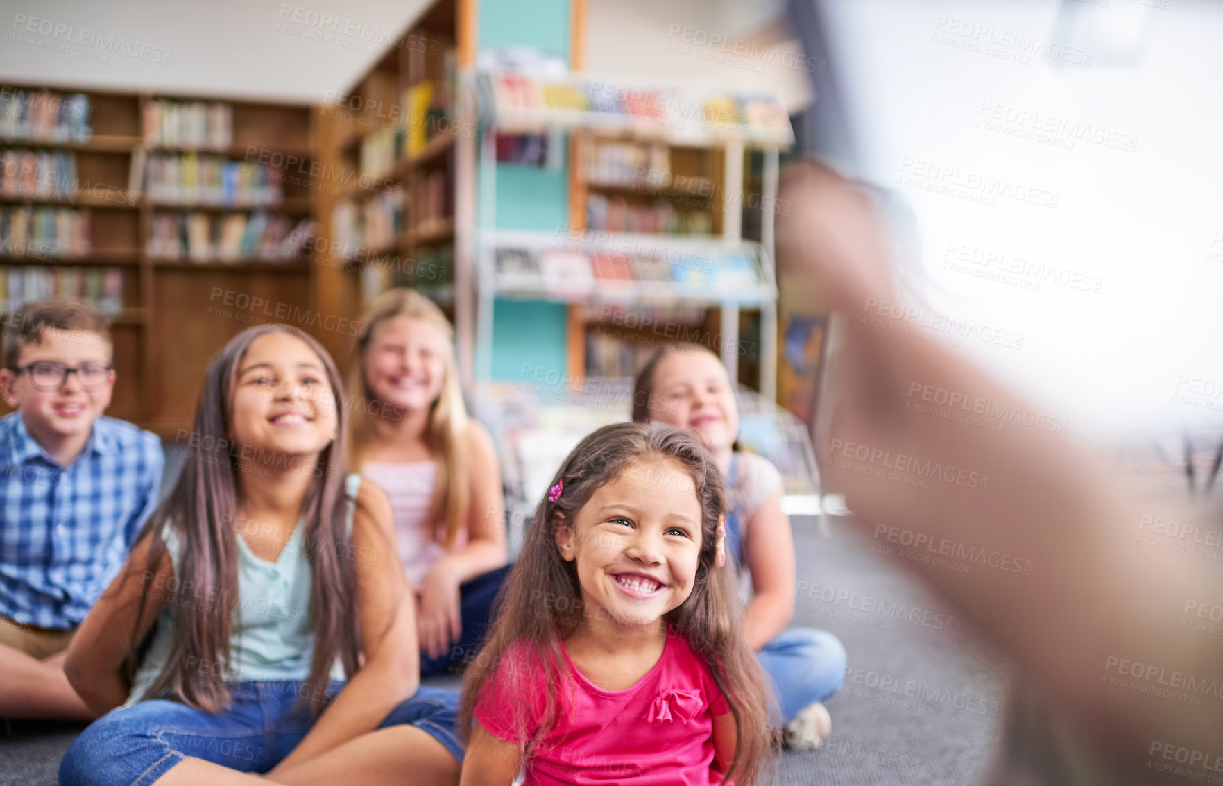 Buy stock photo Happy, school and teacher reading to children in classroom for lesson, learning and story time. Teaching, library and boys and girls listening to literature for knowledge, education and development