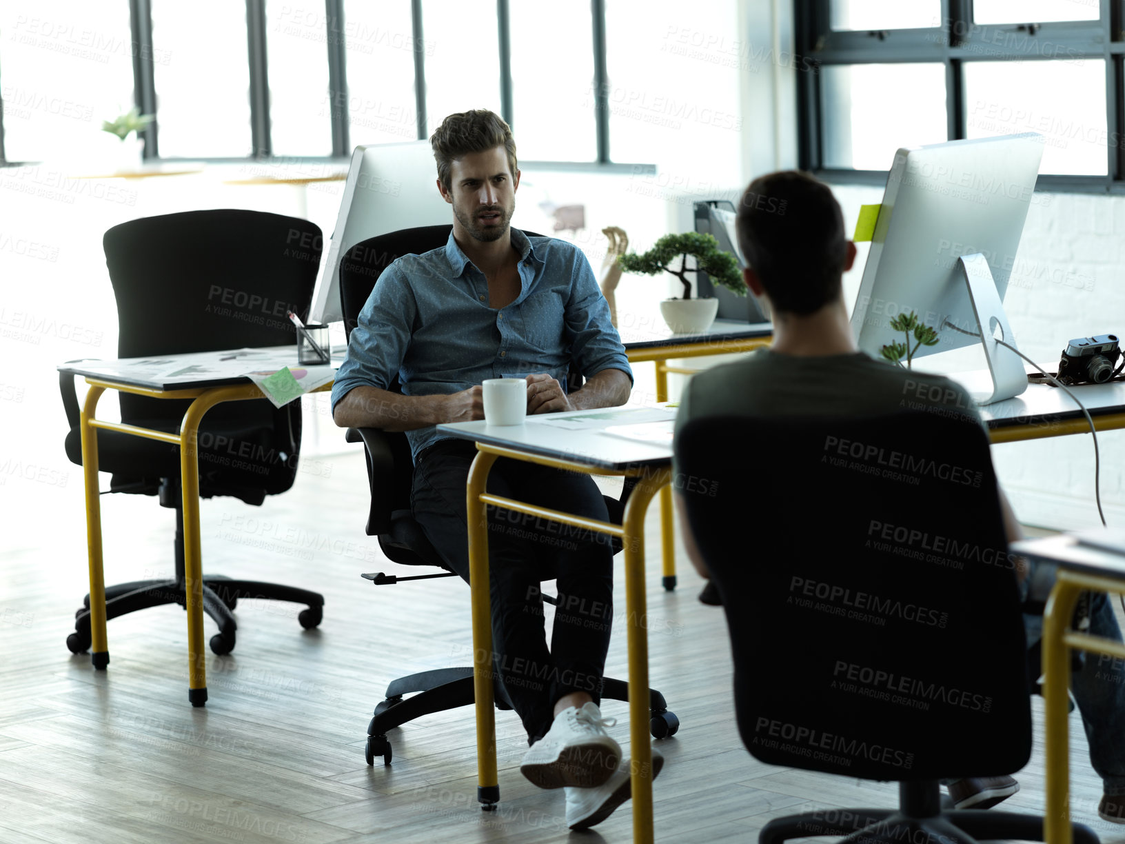 Buy stock photo Businessman, startup partnership and friends chat at desk with discussion, advice and conversation at workplace. Entrepreneur group, teamwork and talk in office for idea, planning and company goals