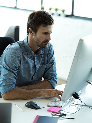 Buy stock photo Serious, computer and search with business man in office for web design, analytics and online. Vision, technology and internet with employee typing in digital agency for idea, advertising and email