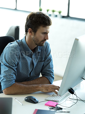 Buy stock photo Concentrating, computer and typing with business man in office for web design, analytics and planning. Vision, technology and internet with employee in digital agency for idea, advertising and email