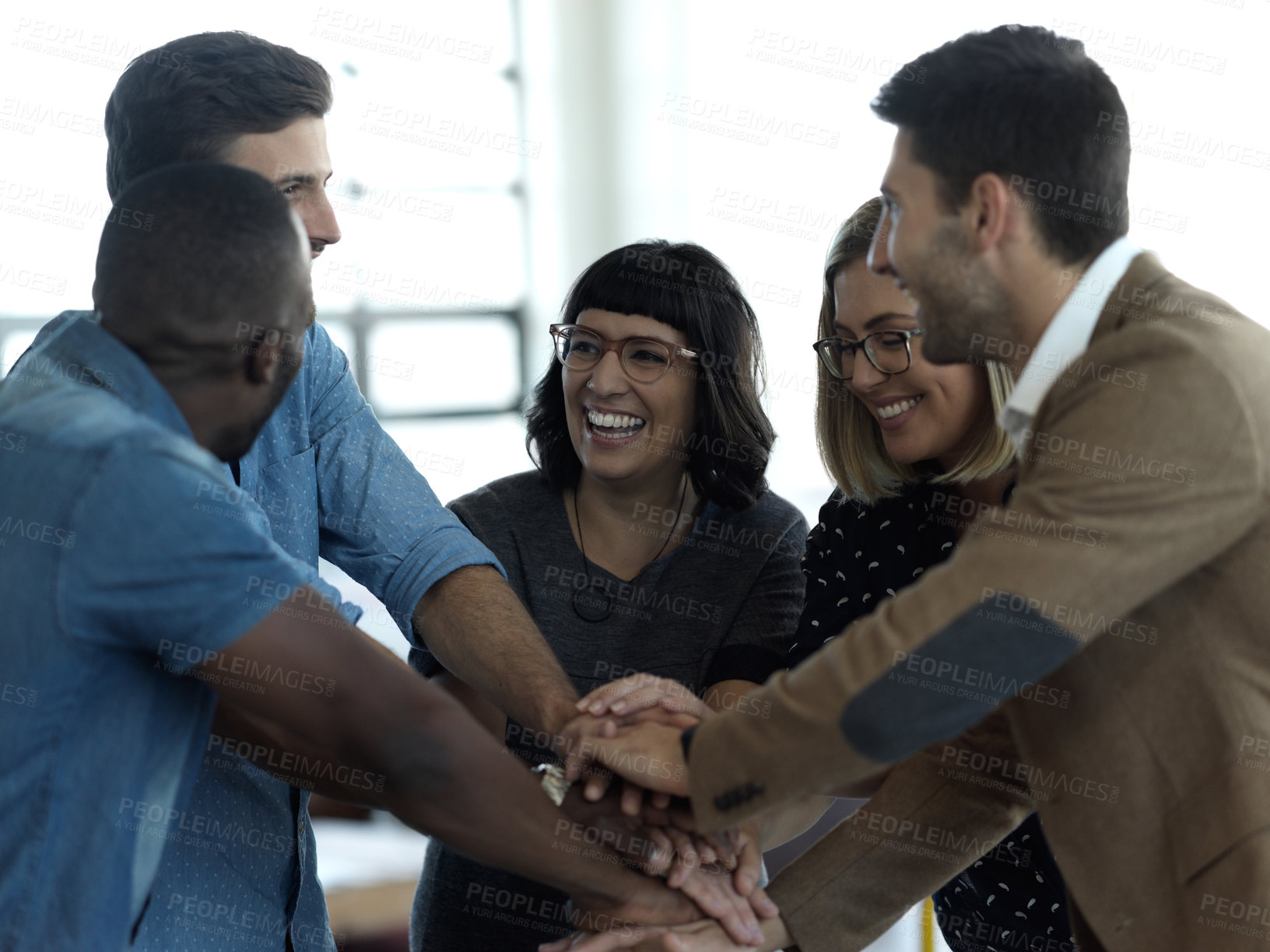 Buy stock photo Support, success and teamwork with business people in office and celebration for motivation, winner or solidarity. Diversity, collaboration or trust with employees hands for goal, community or focus