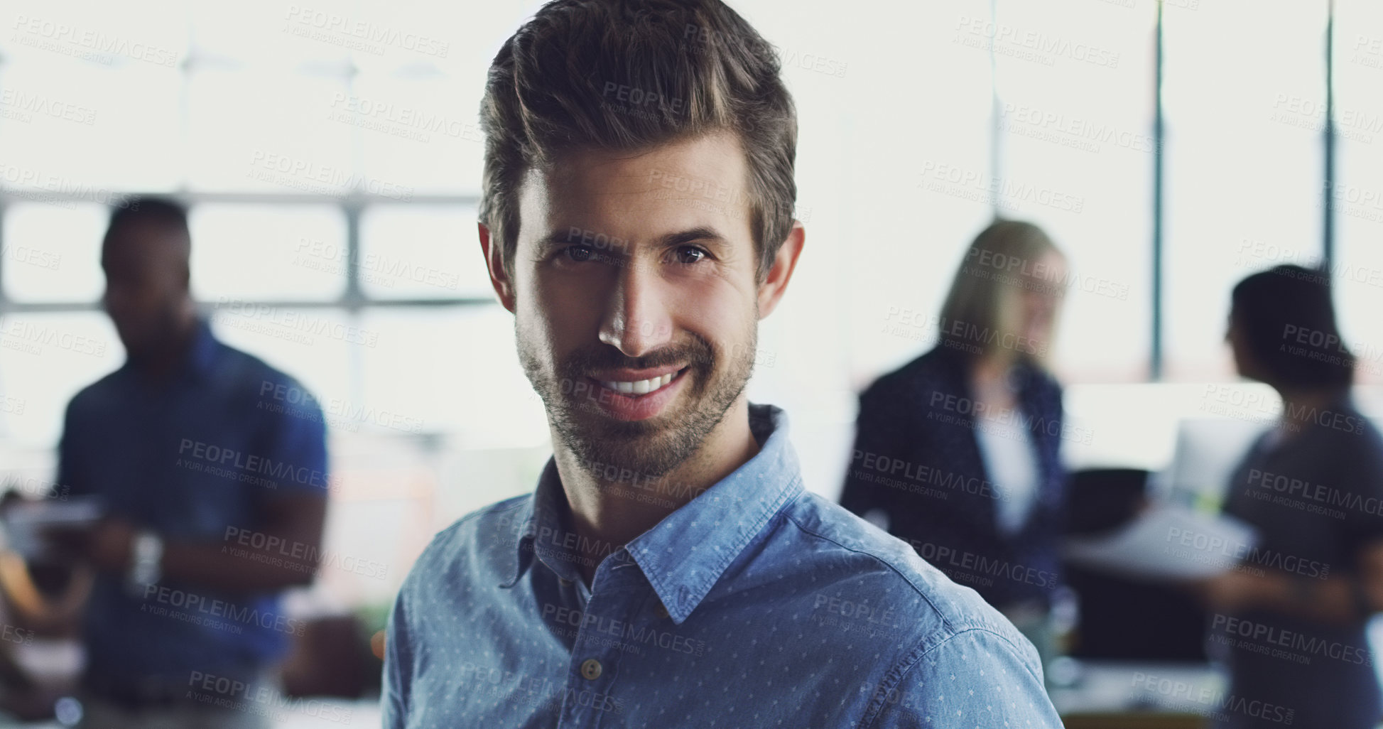 Buy stock photo Portrait, confident and business man in an office with a smile, happy and proud of startup growth. Young, worker and employee with a positive mindset at his workplace as an entrepreneur