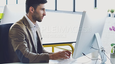 Buy stock photo Research, planning and serious with businessman at computer for designer, idea and email. Technology, internet and creative with person typing in digital agency startup for data, vision and focus