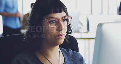 Buy stock photo Computer, serious and business woman working in an office at a startup company planning in an agency using internet. Employee, worker or female journalist brainstorming a story at her workplace