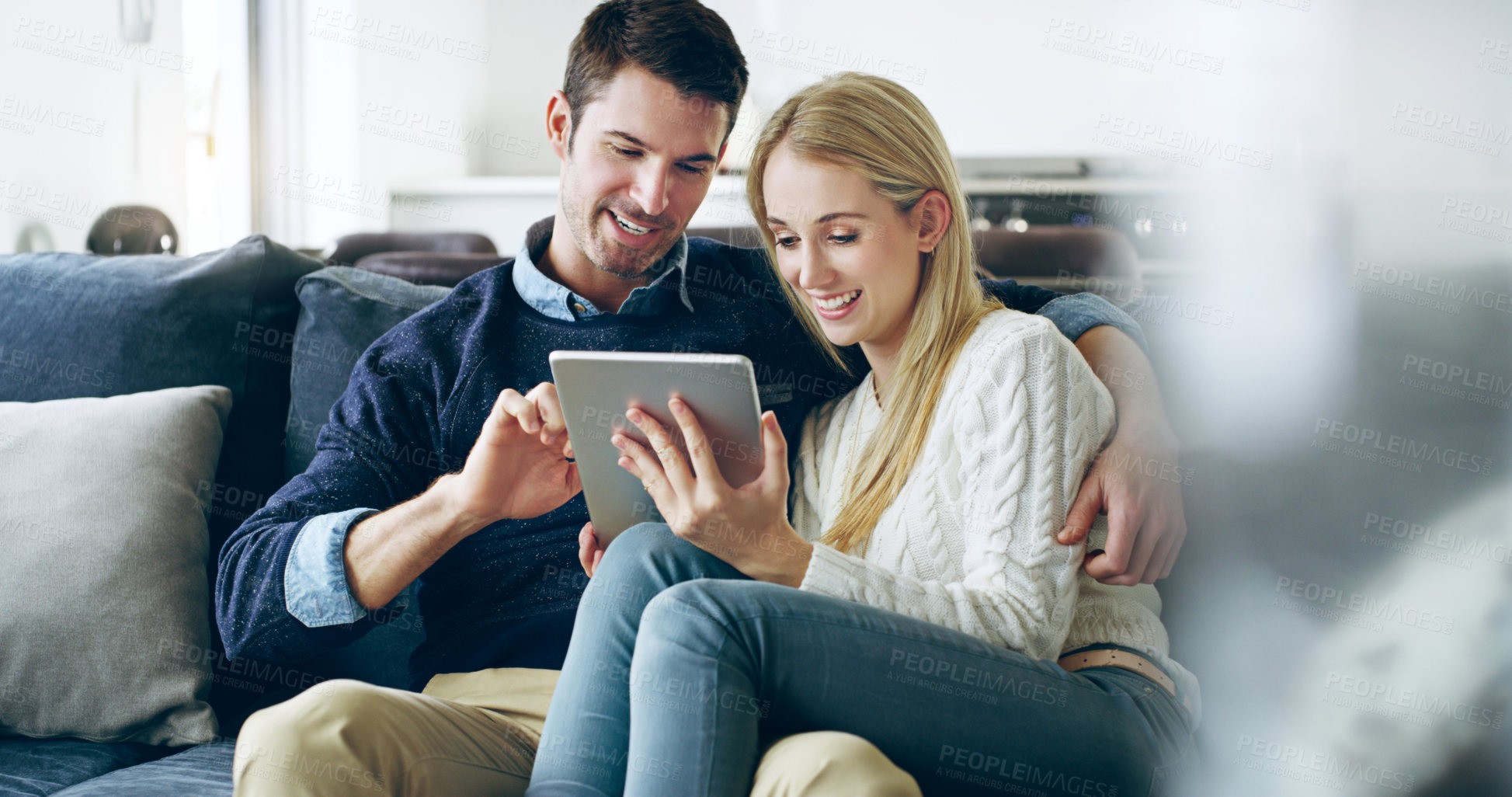 Buy stock photo Couple, tablet and happy to relax on couch, video and streaming with subscription on web in living room. Man, woman and digital touchscreen for film, movies and smile for hug with bonding in home