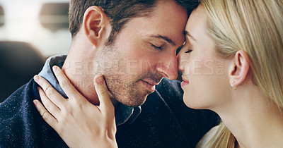Buy stock photo Cropped shot of an affectionate young couple sharing a loving moment in their home