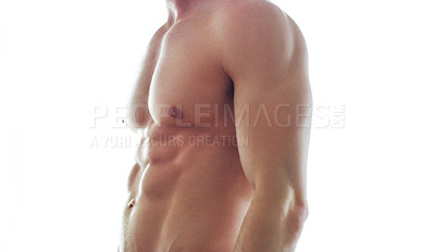 Buy stock photo Cropped shot of a muscular man standing shirtless against a white background