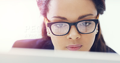 Buy stock photo Cropped shot of an attractive young businesswoman working on her computer in the office