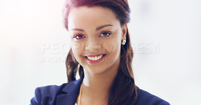Buy stock photo Cropped portrait of an attractive young businesswoman smiling happily in her office