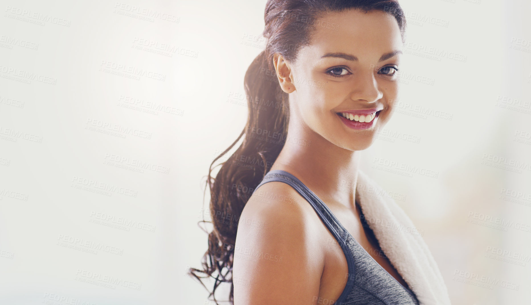 Buy stock photo Cropped portrait of an attractive young woman during her workout at home