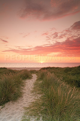 Buy stock photo Sunset sky, beach and landscape, nature and travel with environment and coastal location in Denmark. Fresh air, grass and path with seaside destination and ocean view, outdoor and natural scenery