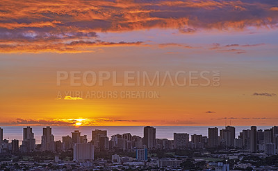 Buy stock photo A fiery red sunset cityscape and beach with sunset sky in evening. Birds eye view of a city and colorful sky with clouds at night background with summer sunrise and wonderful view of an urban town 