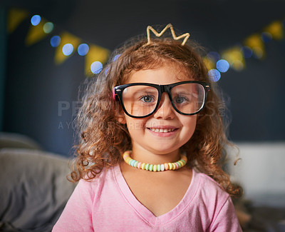 Buy stock photo Princess, costume and smile with portrait of child for Halloween, festival and trick or treat. Crown, happy and night with girl and candy necklace at home for fantasy, celebration and fairytale