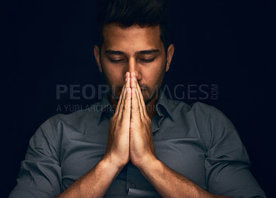 Buy stock photo Night, worship and man with hands praying in studio to God, Jesus Christ or spiritual healing on black background. Holy, gratitude and thank you by christian male in prayer for help, hope and trust