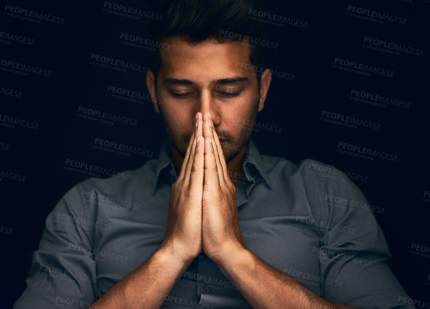 Buy stock photo Night, worship and man with hands praying in studio to God, Jesus Christ or spiritual healing on black background. Holy, gratitude and thank you by christian male in prayer for help, hope and trust