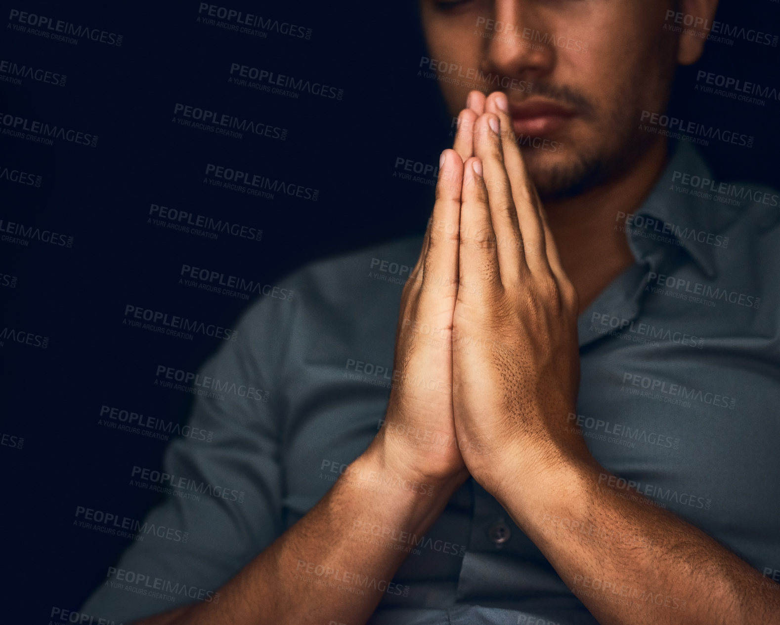 Buy stock photo Praying, worship and hope with hands of man for religion, spirituality and faith. Focus, thinking and peace with closeup of person and mockup space on dark background for belief, prayer and gratitude