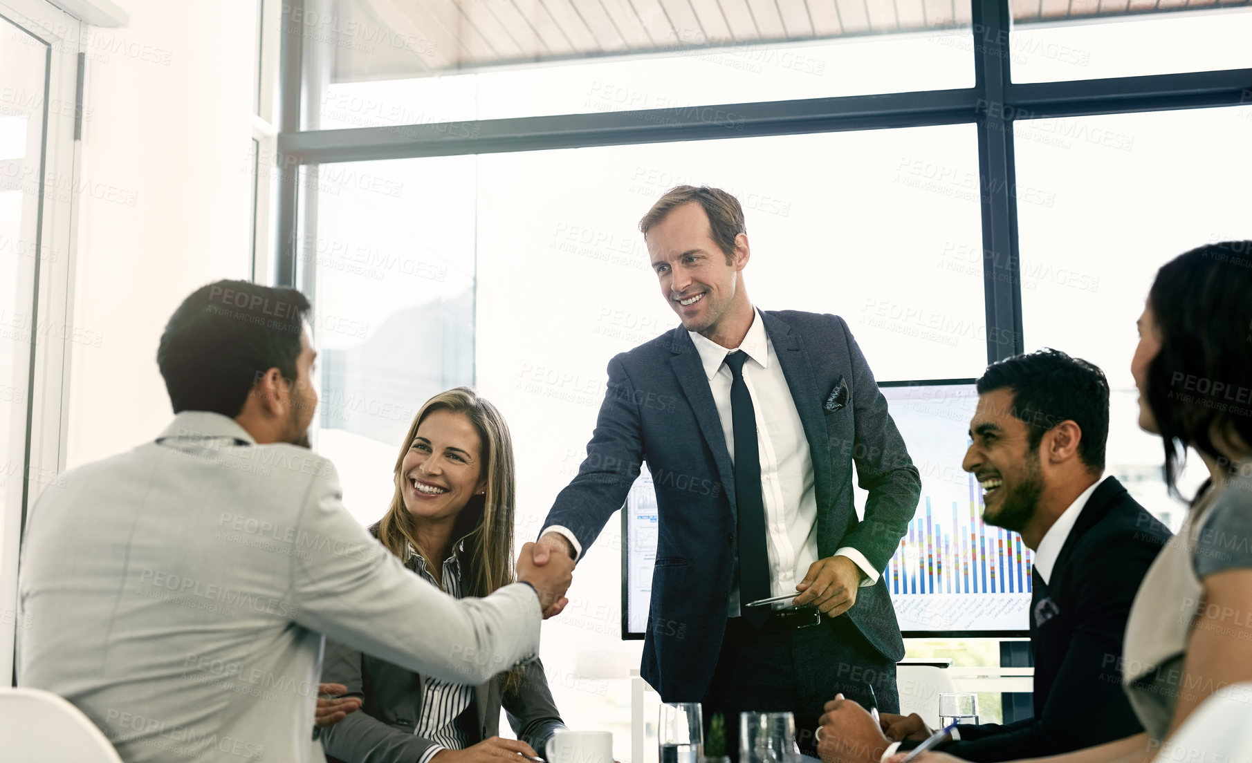 Buy stock photo Shot of corporate businesspeople meeting in the boardroom