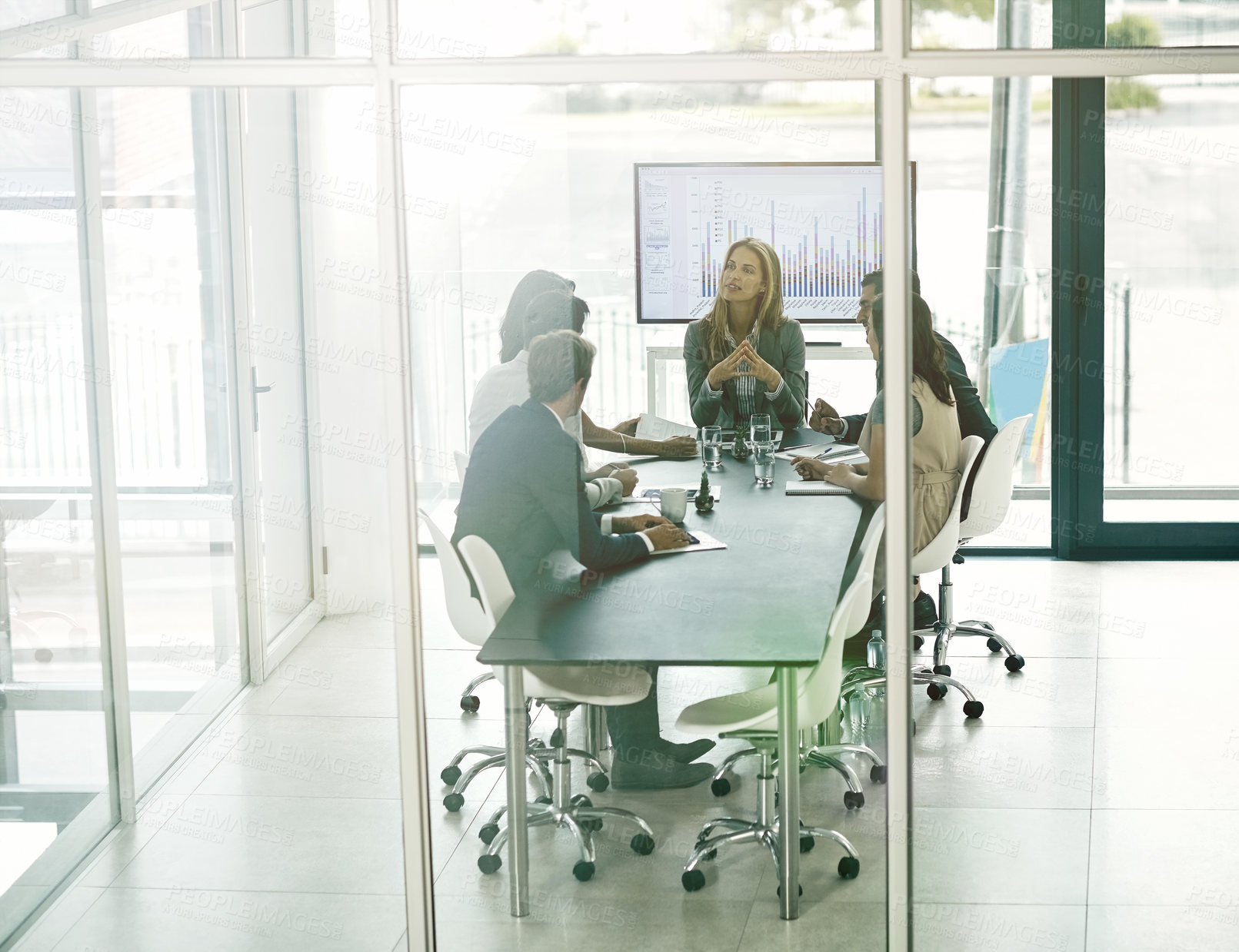 Buy stock photo Shot of corporate businesspeople meeting in the boardroom