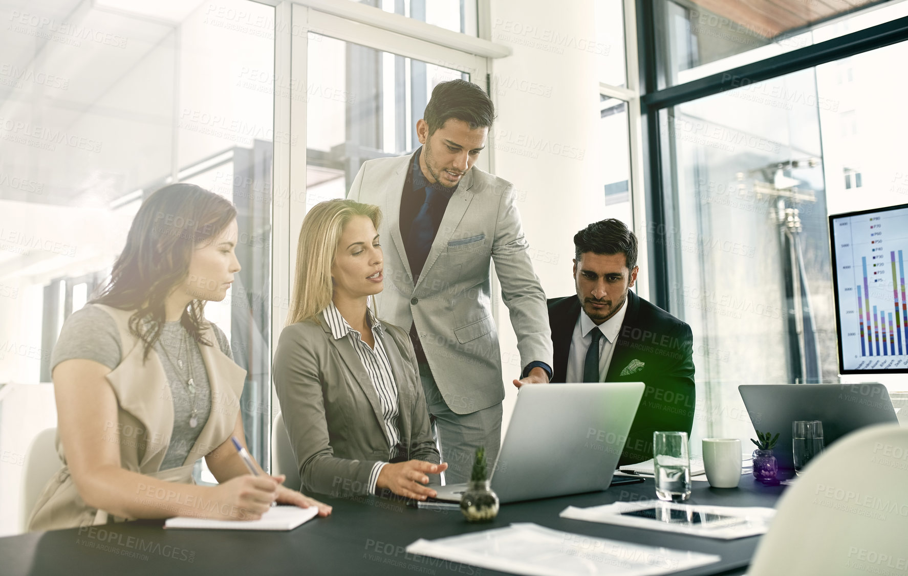 Buy stock photo Shot of corporate businesspeople meeting in the boardroom