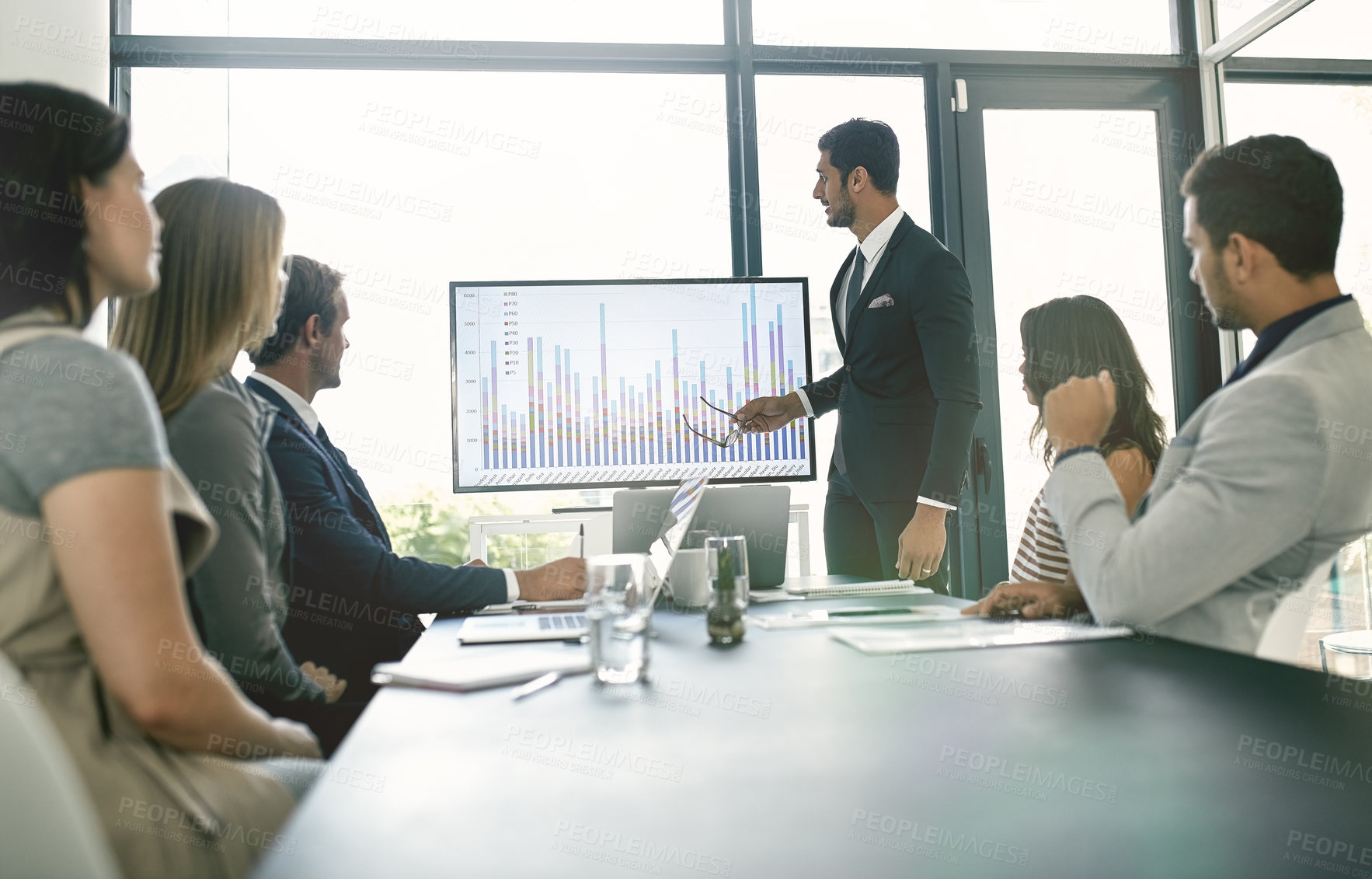 Buy stock photo Shot of corporate businesspeople meeting in the boardroom