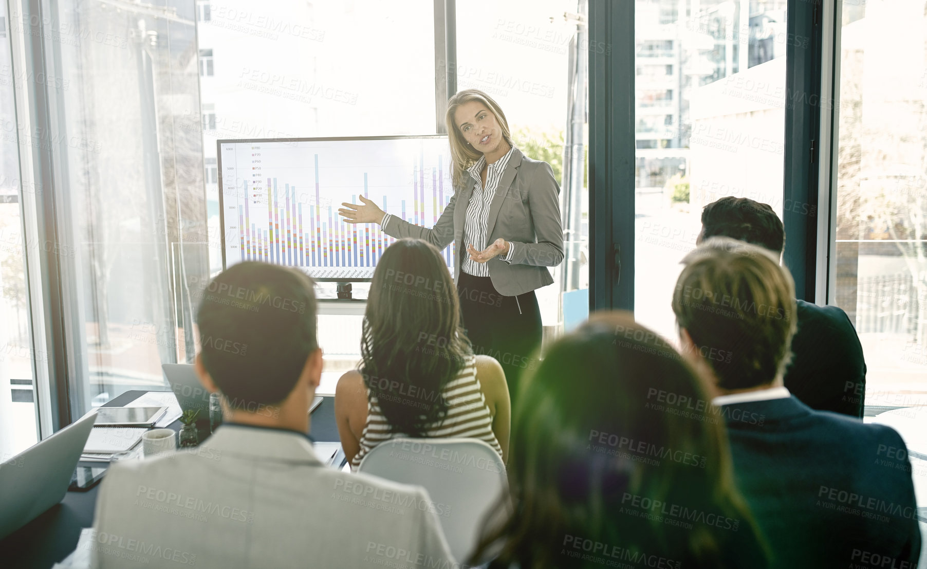 Buy stock photo Shot of corporate businesspeople meeting in the boardroom