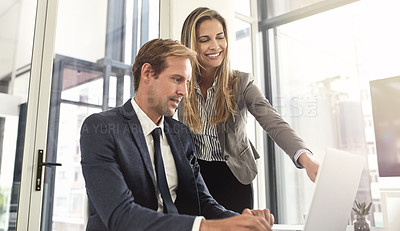 Buy stock photo Shot of a two executives working together in an office