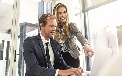 Buy stock photo Shot of a two executives working together in an office