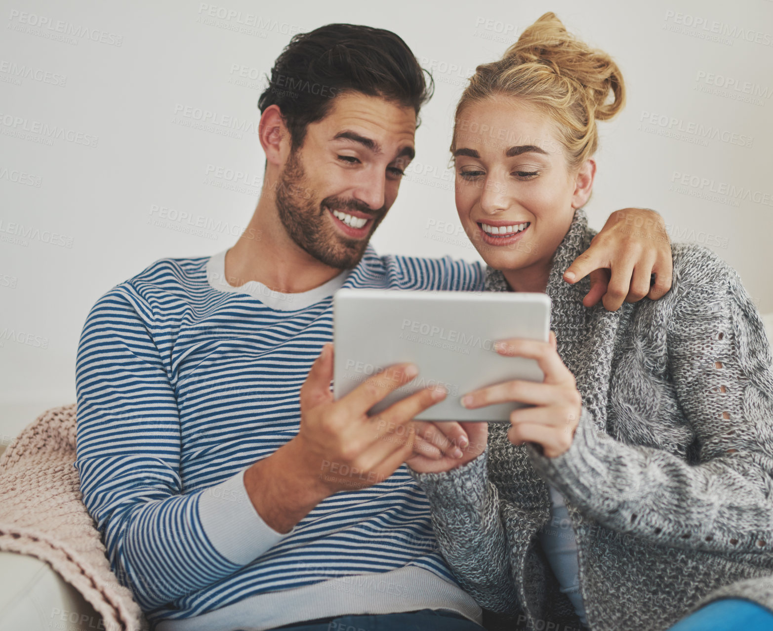 Buy stock photo Couple, reading or tablet for choice, news and movie streaming online on couch in living room. Technology, internet or people in lounge on social network app on digital website or touchscreen in home