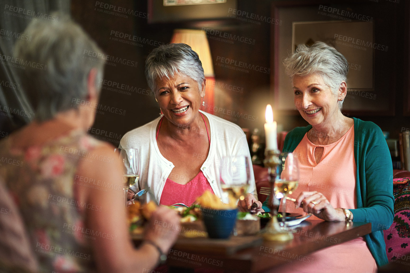 Buy stock photo Cropped shot of a group of senior female friends enjoying a lunch date