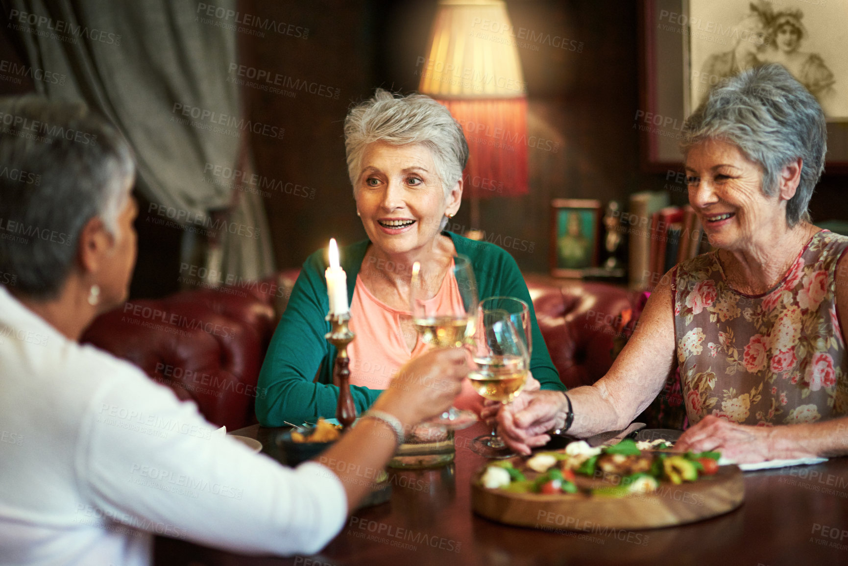 Buy stock photo Senior women, friends and toast in restaurant for wine, vacation and retirement together with happy. Elderly people, reunion and cheers in diner for drinks, holiday and social celebration with memory